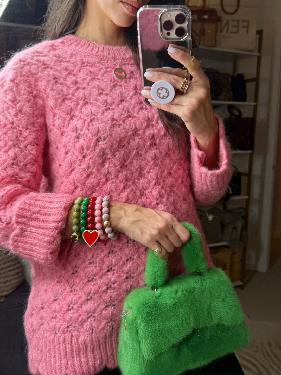 Pink sweater and bracelets